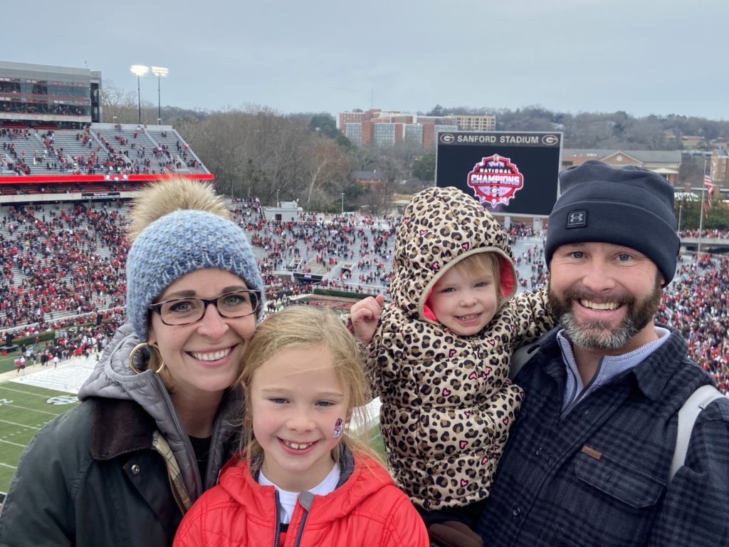 Whitney Murphy with her family at the 2021 College Football National Championship Celebration in Sanford Stadium