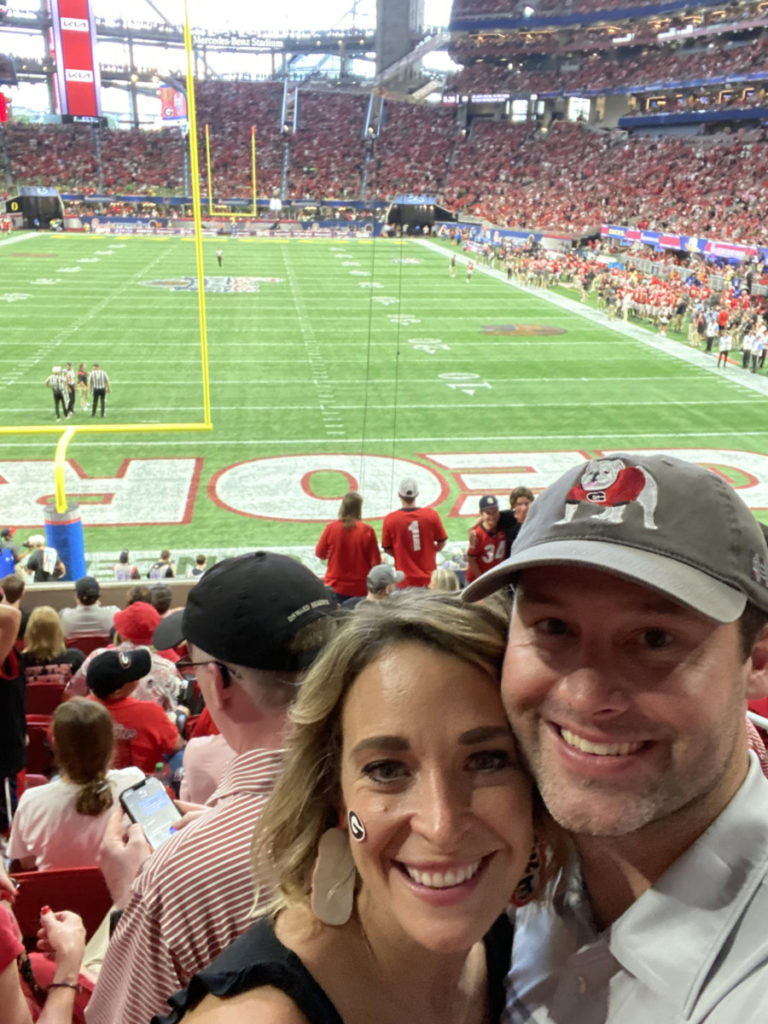 Whitney and Zach at a football game in Mercedes Benz Stadium in Atlanta