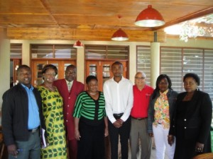 Drs. Chinnan and Mwangwela in Lilongwe, Malawi with small scale processors during discussion of improving quality of peanut products.