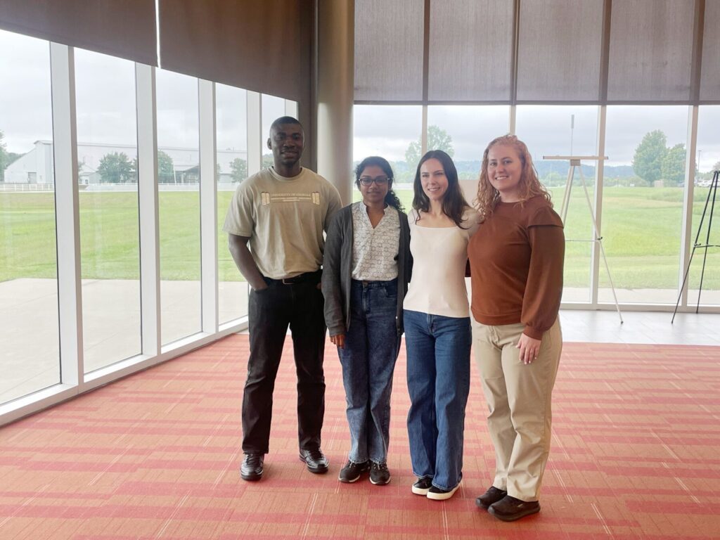 Amelia Brady, Dennis Bffour-Awuah and Ruwini Bandara pose for a picture at the VxM annual project meeting