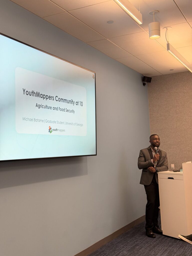 Michael Batame presenting at YouthMappers 10th anniversary