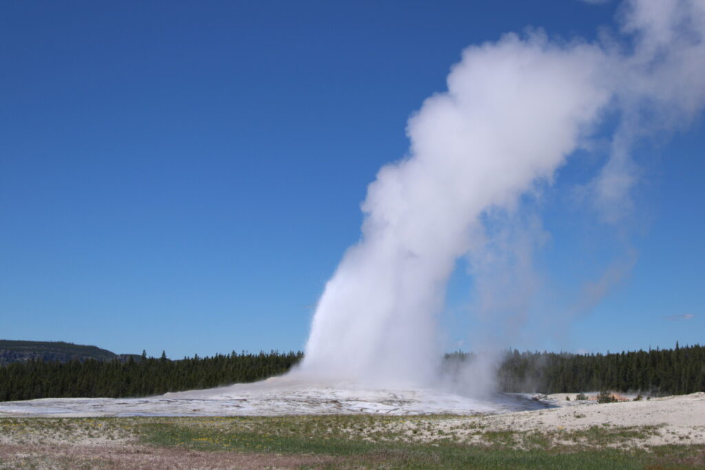 A picture of smoke from the ground in Yellowstone National Park, Montana