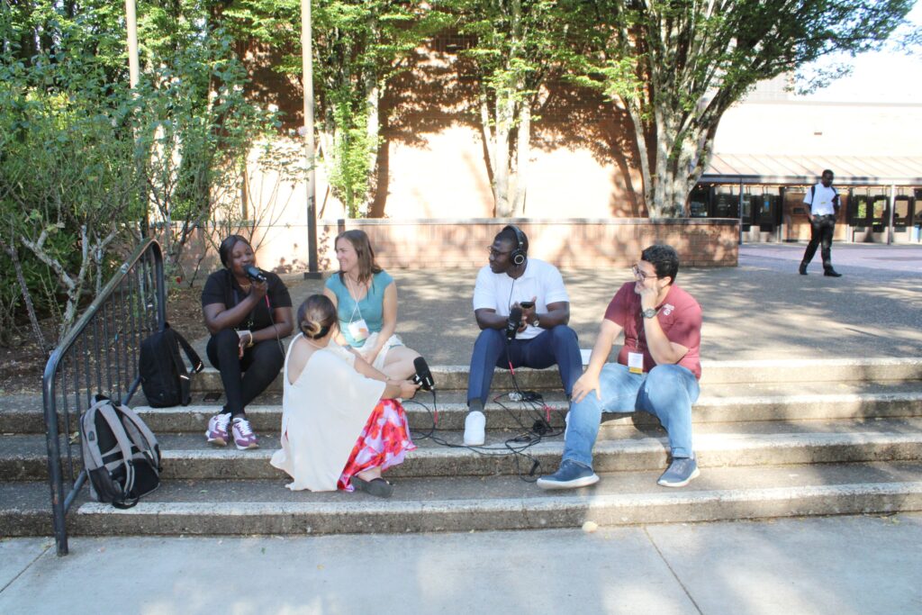 Dennis talking to Emilia Astorga Roine from Chile and Adedamola Sanuade from Nigeria, both at Oregon State University; Danial Nayeri from Iran at Texas A&M University; and Katherine Pivaral from Guatemala at Purdue University