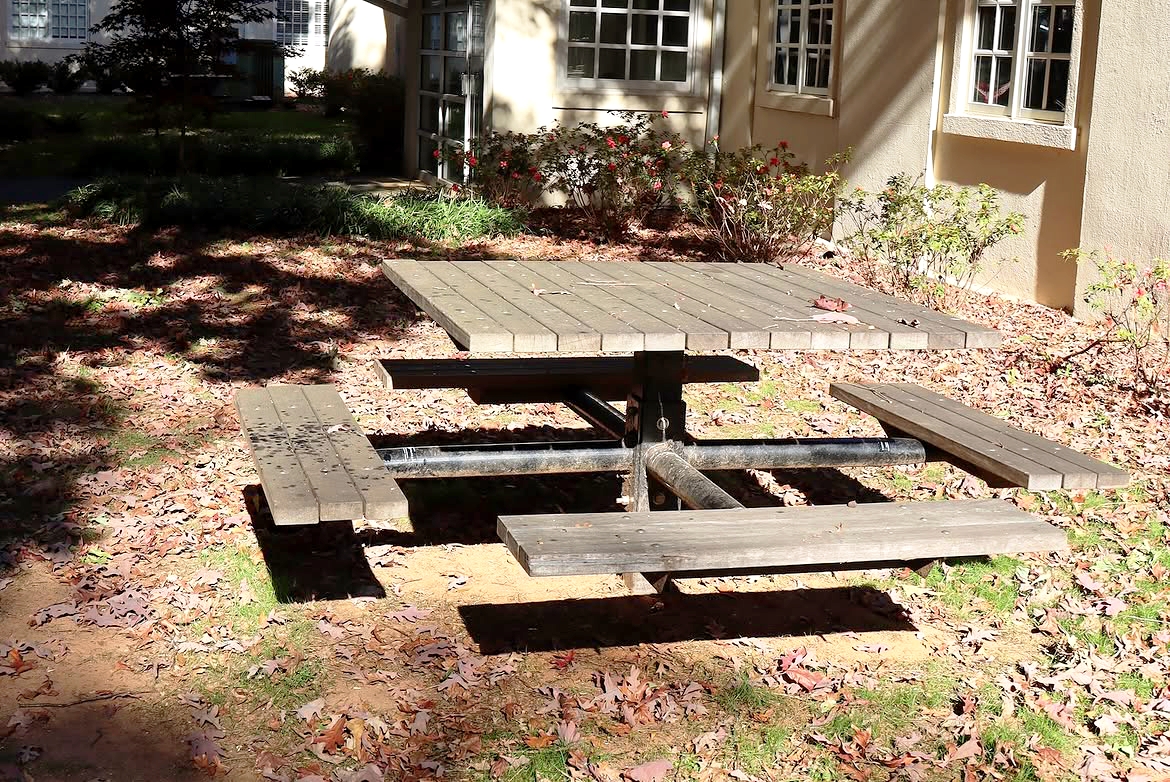 benches in front of four towers