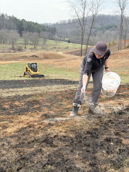 A person seeding at Mercier Orchards
