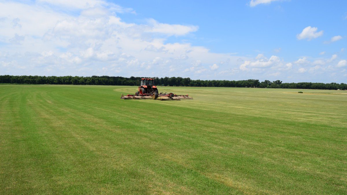 Picture of a tractor cutting grass 