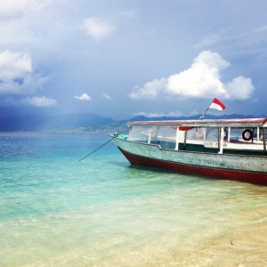 A local longboat with one of the other islands, Gili Meno, in the background.